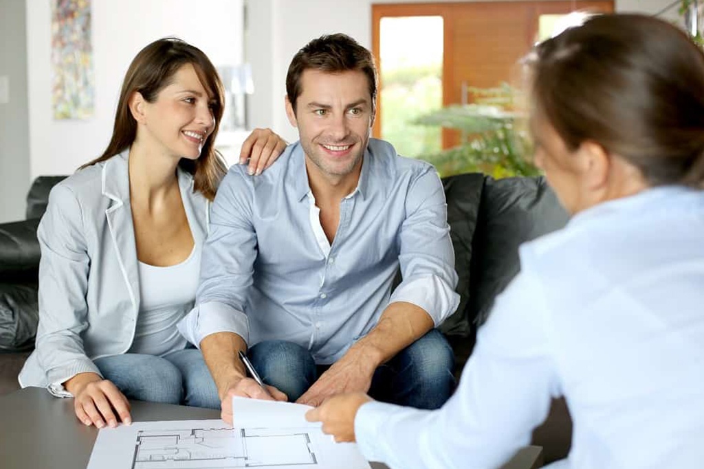 Realtor and Couple Talking